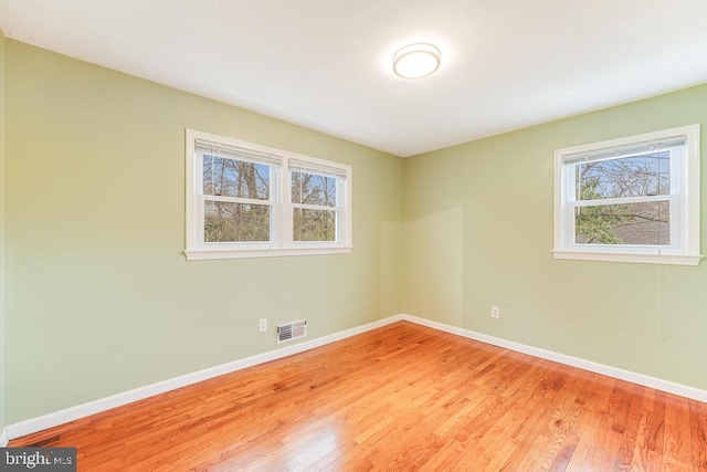 unfurnished room featuring light wood-type flooring