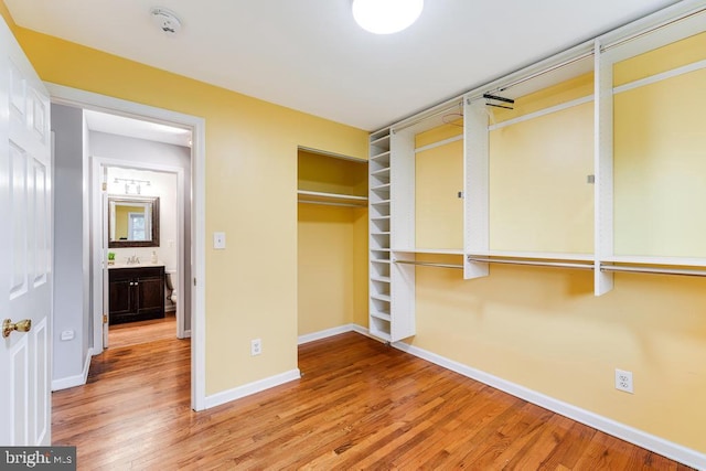 unfurnished bedroom with a closet and wood-type flooring