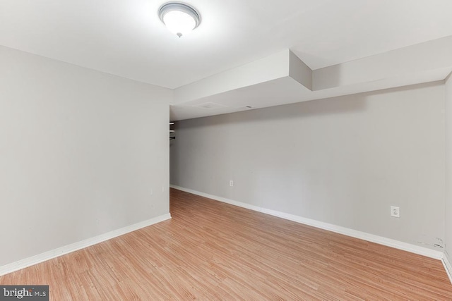 basement with light hardwood / wood-style floors