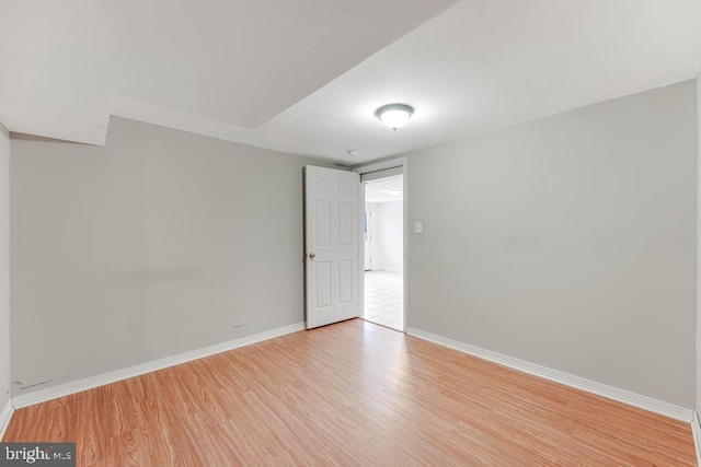 spare room with light wood-type flooring