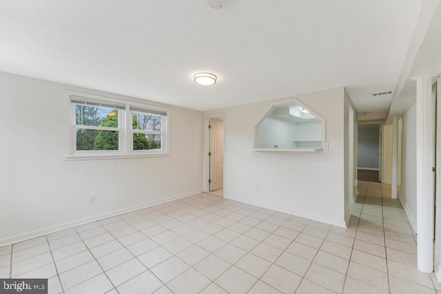 view of tiled spare room