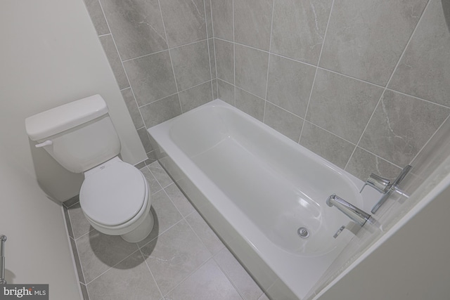 bathroom featuring tile patterned flooring and toilet