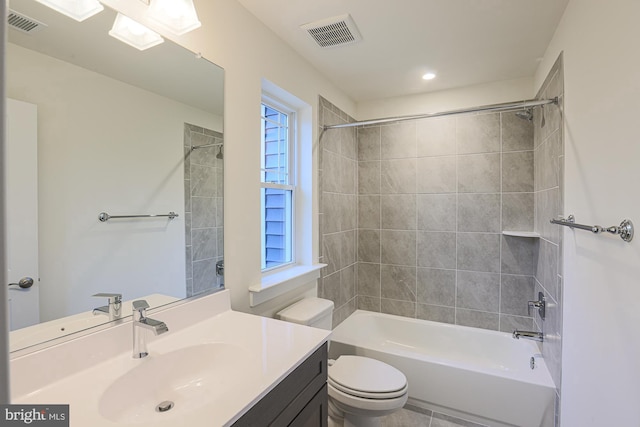 bathroom with toilet, washtub / shower combination, visible vents, and vanity