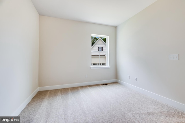 unfurnished room with carpet floors