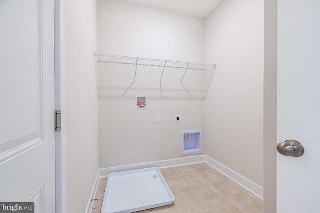 washroom with light tile patterned floors, washer hookup, and hookup for an electric dryer