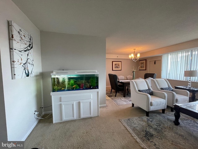 living room featuring light colored carpet and an inviting chandelier