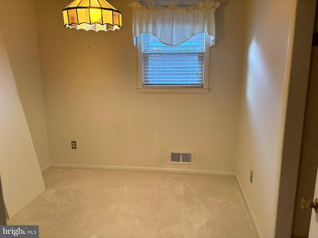 unfurnished room featuring light colored carpet