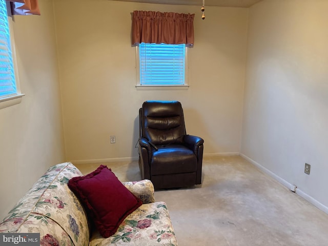 sitting room with light colored carpet