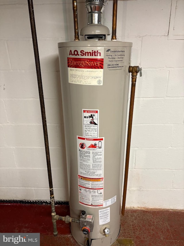 utility room featuring gas water heater