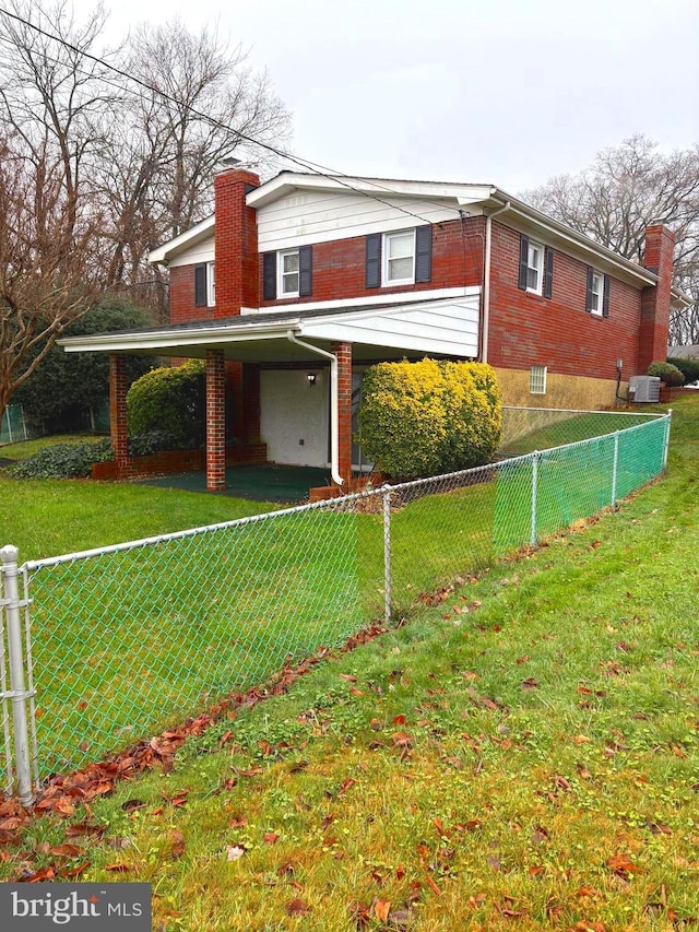 view of side of home featuring a lawn