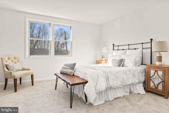 carpeted bedroom featuring baseboards