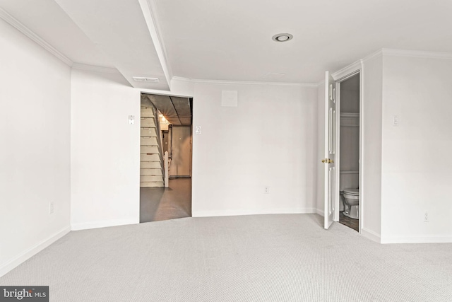 unfurnished bedroom with carpet floors, baseboards, and crown molding