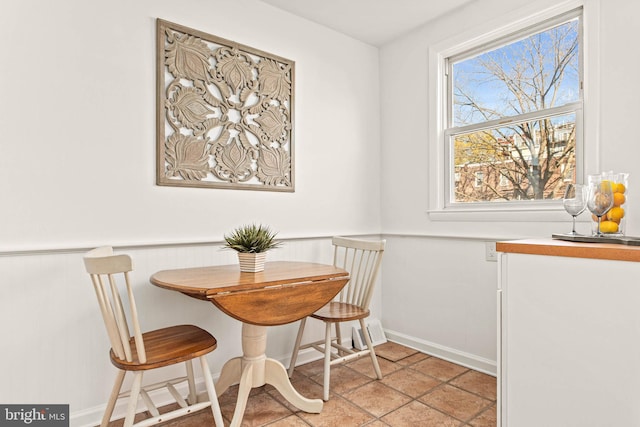dining space featuring baseboards and breakfast area
