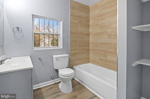 bathroom with vanity, wood-type flooring, and toilet