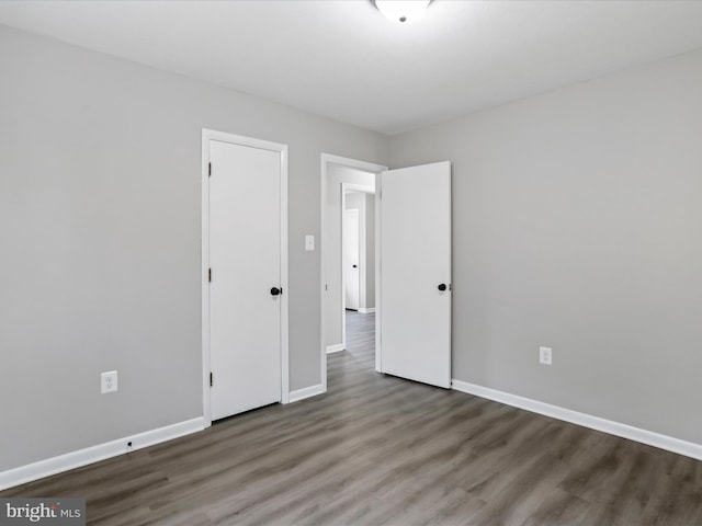 unfurnished bedroom featuring wood-type flooring