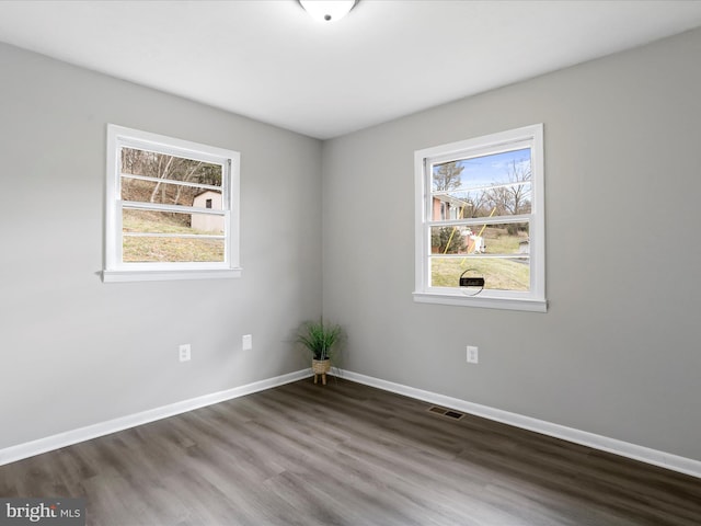 empty room with wood-type flooring