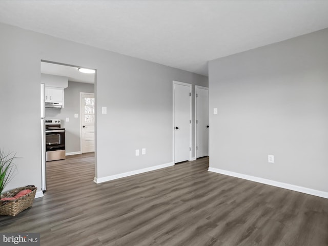 unfurnished room featuring dark hardwood / wood-style flooring