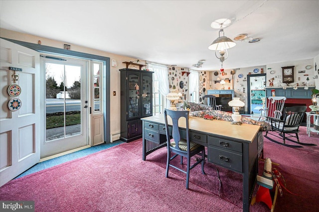 carpeted office space with a baseboard radiator