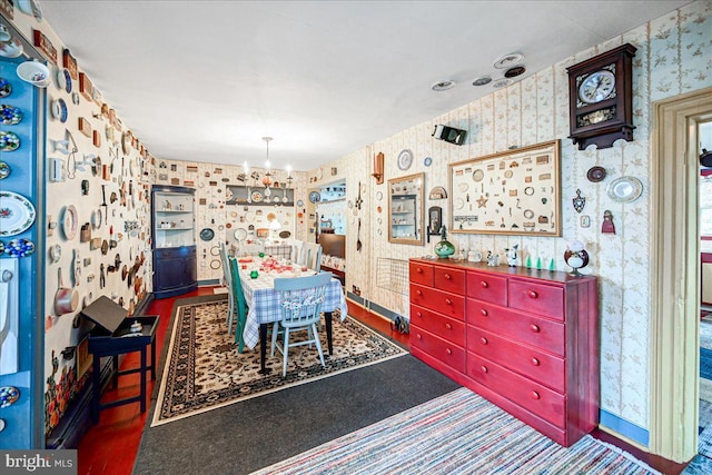 carpeted dining area with a notable chandelier