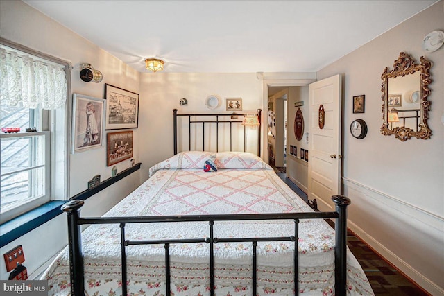 bedroom with wood-type flooring