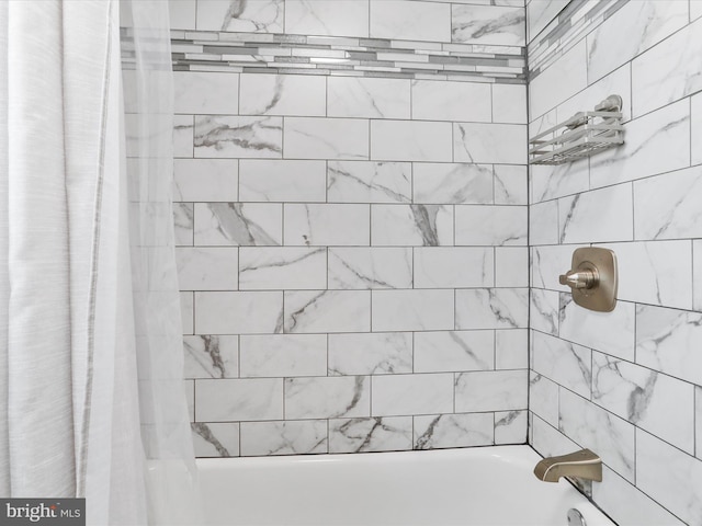 bathroom featuring shower / bath combo with shower curtain