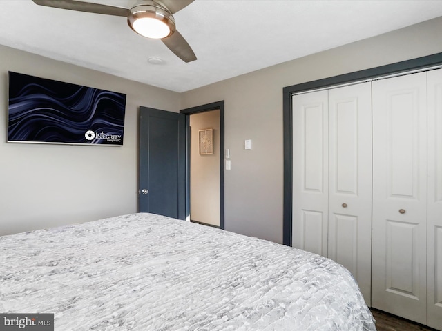 bedroom featuring ceiling fan and a closet