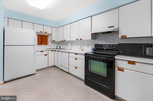 kitchen with decorative backsplash, white cabinetry, sink, and black appliances