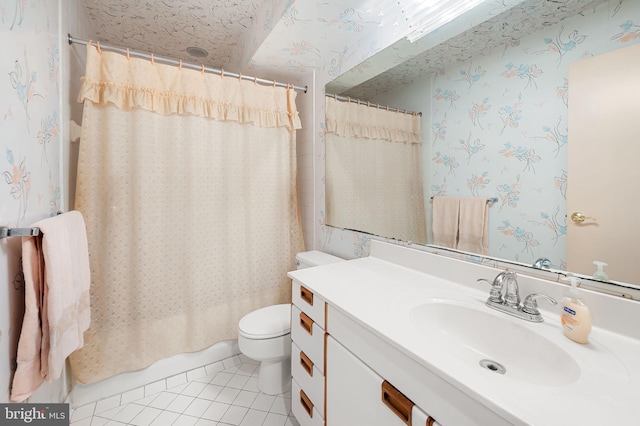 bathroom featuring tile patterned floors, vanity, and toilet