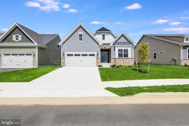 craftsman house featuring a garage and a front lawn