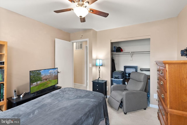 carpeted bedroom with a closet and ceiling fan