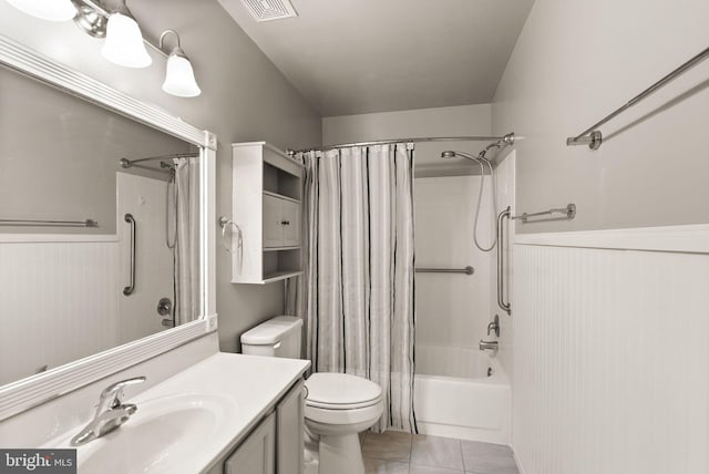 full bathroom with tile patterned flooring, shower / bath combo, toilet, and vanity