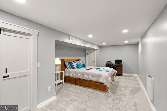 bedroom featuring light carpet