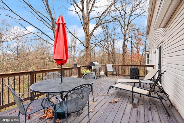 wooden terrace featuring grilling area