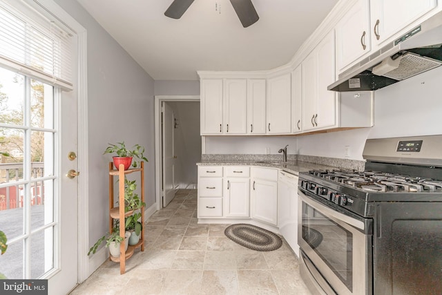 kitchen with white cabinets, sink, light stone countertops, and stainless steel range with gas stovetop