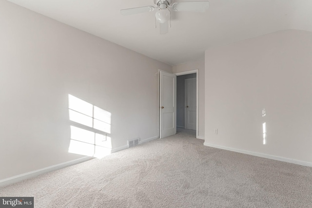 empty room featuring light carpet and ceiling fan