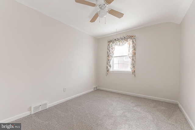 unfurnished room with ceiling fan, carpet, and vaulted ceiling