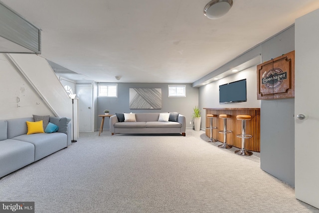 carpeted living room with bar