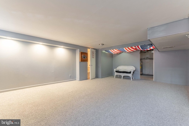 basement featuring carpet floors and water heater