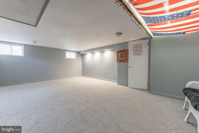 basement featuring carpet and plenty of natural light