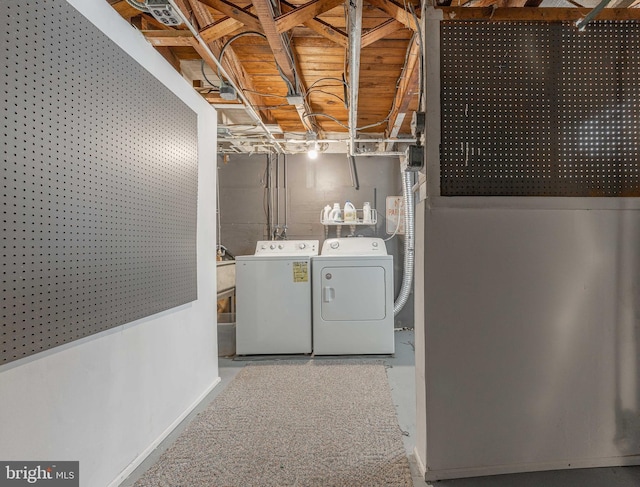 washroom with independent washer and dryer