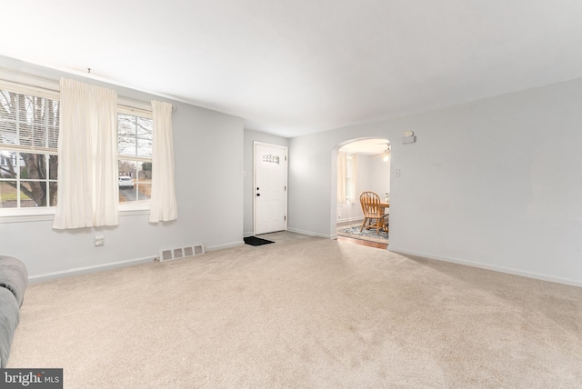 interior space featuring light colored carpet