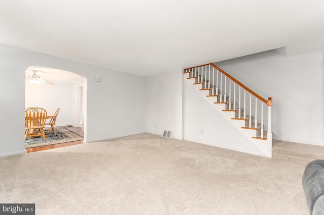 living room with carpet and ceiling fan