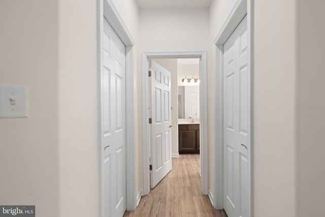 hall with light hardwood / wood-style flooring