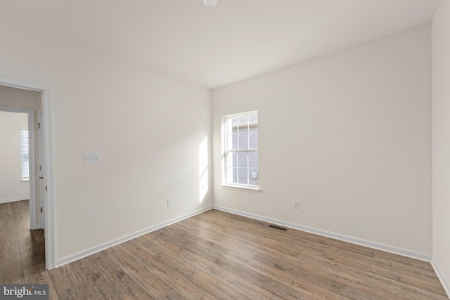 unfurnished room featuring light wood-type flooring