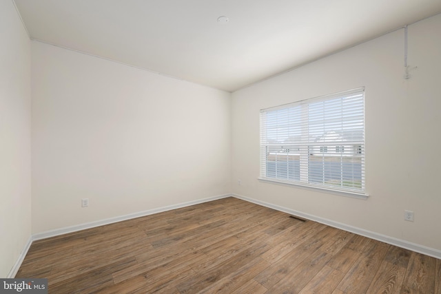 empty room featuring hardwood / wood-style floors