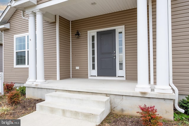 property entrance featuring a porch