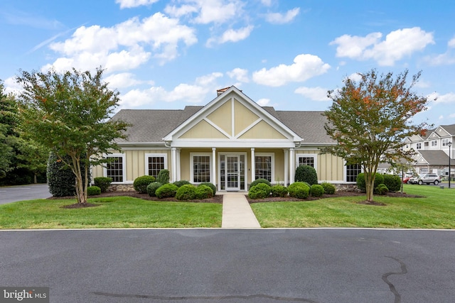 view of front of home featuring a front yard and covered porch