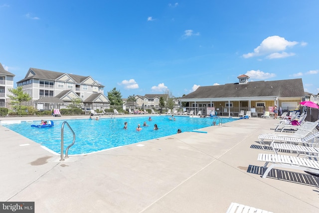 view of swimming pool featuring a patio