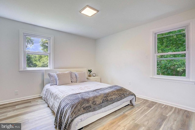 bedroom with light wood-type flooring