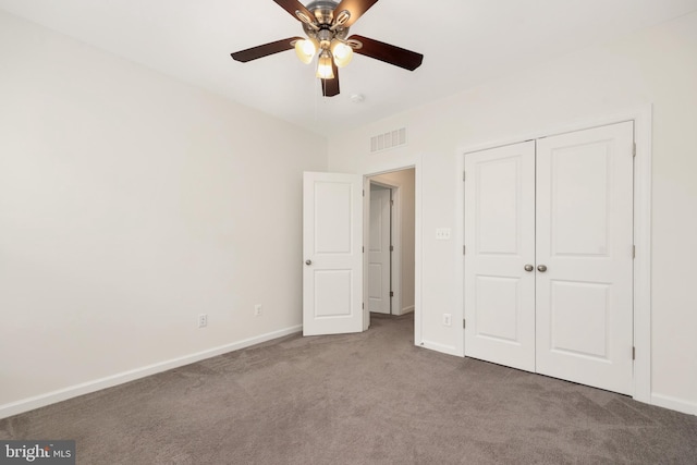 unfurnished bedroom featuring ceiling fan, carpet floors, and a closet